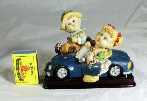 Kids riding in a convertible
