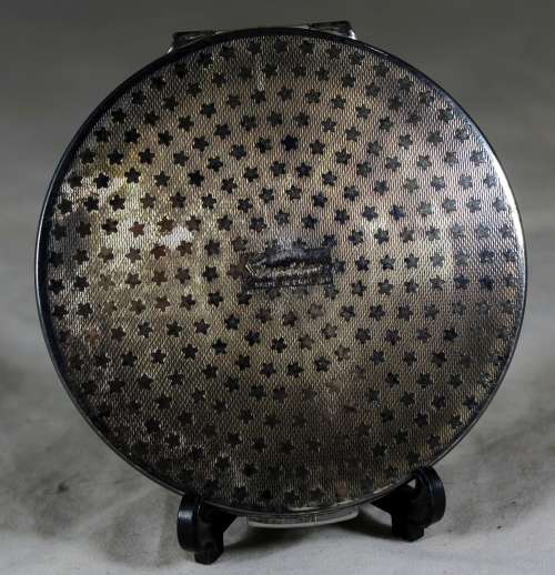 Straton powder compact with purple flowers