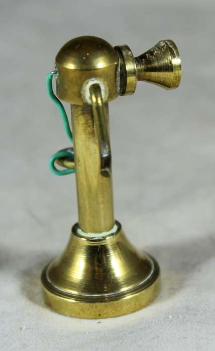 Miniature bronze vintage telephone