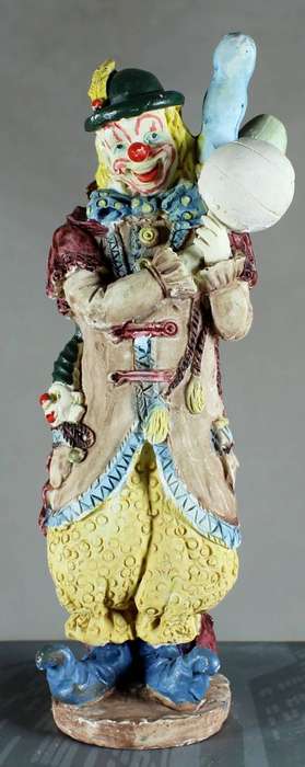 Clown figurine with balloons and puppet