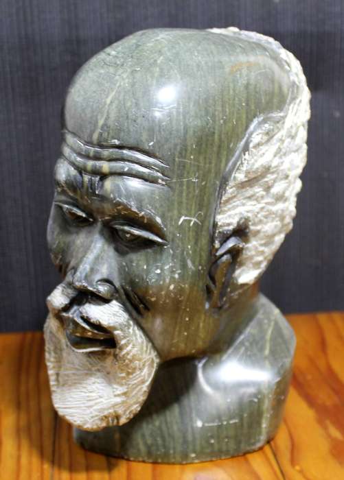 Carved stone head