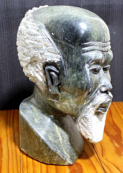 Carved stone head