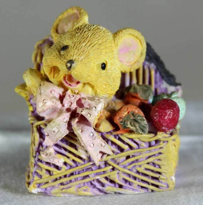 Miniature mouse in a chest