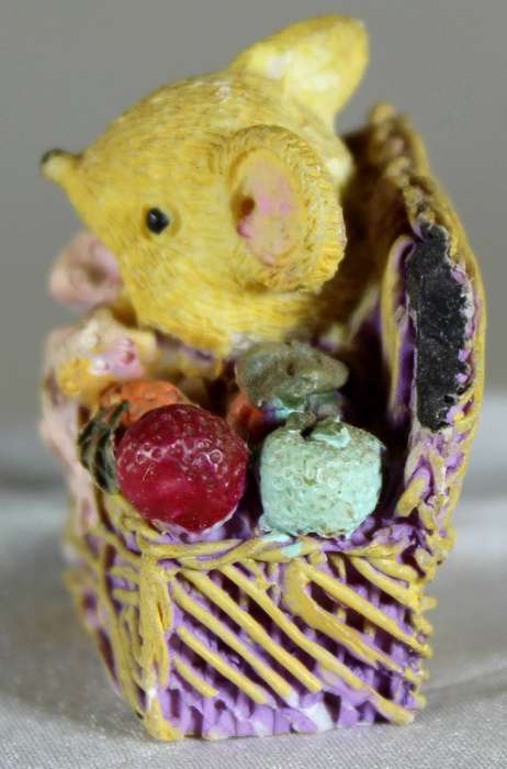 Miniature mouse in a chest