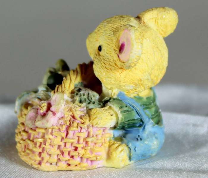 Miniature mouse in a basket