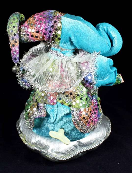 Wind-up gypsy girl on cushion