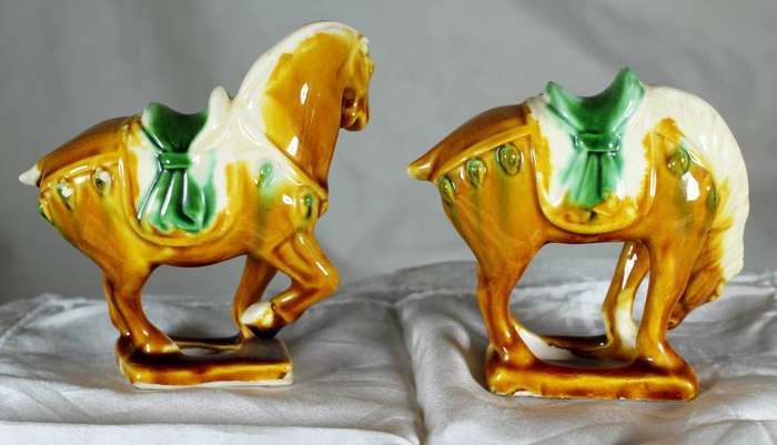 Pair of Chinese style horses with satchel