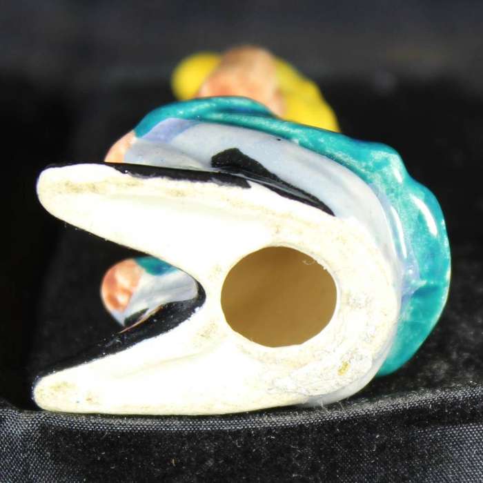 Porcelain pixie sitting