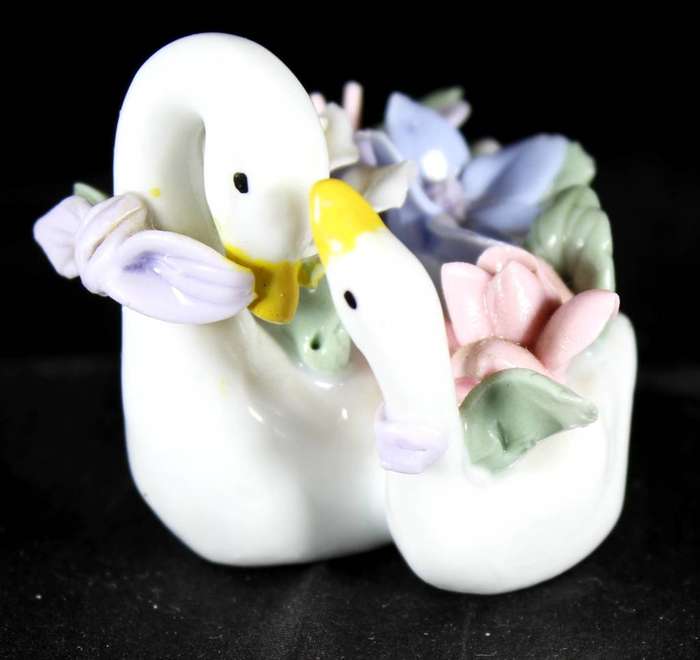 Two swans with flowers