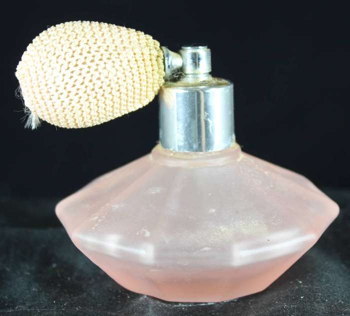 Vintage peach perfume bottle with atomizer