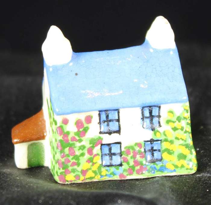 Miniature house with blue roof