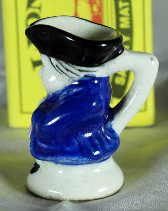 Miniature Toby jug with blue jacket