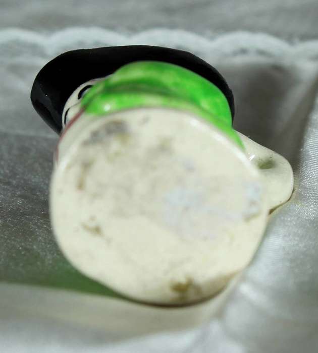 Miniature Toby jug with green jacket