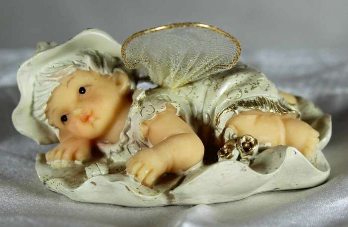 Vintage ceramic Tinkerbell figurine with flower wings
