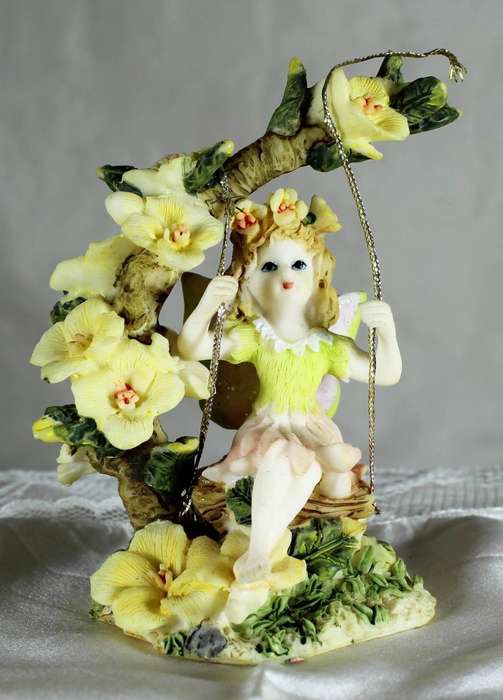 Flower fairy on swing - Yellow flowers