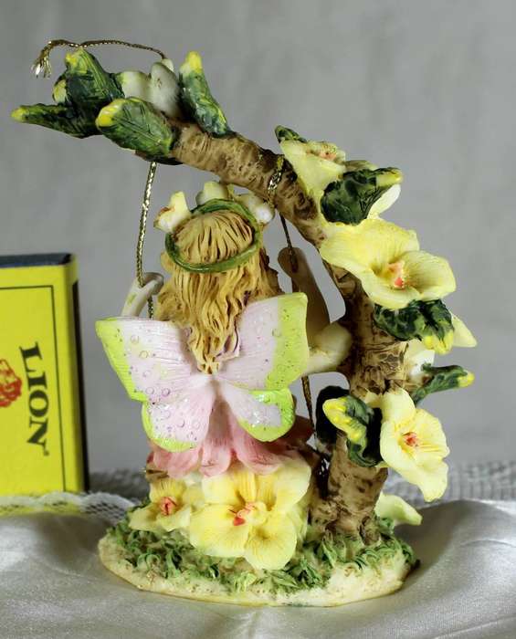 Flower fairy on swing - Yellow flowers