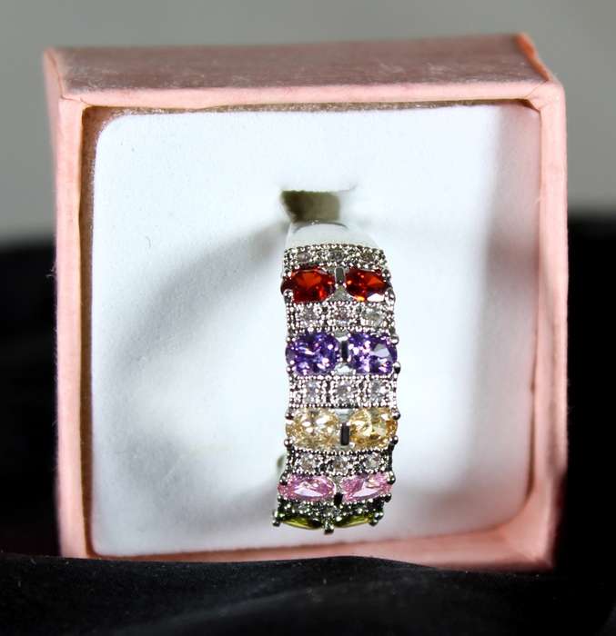 Costume jewellery - five coloured emerald look ring
