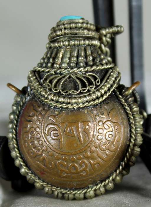 Small brass snuff container with spoon