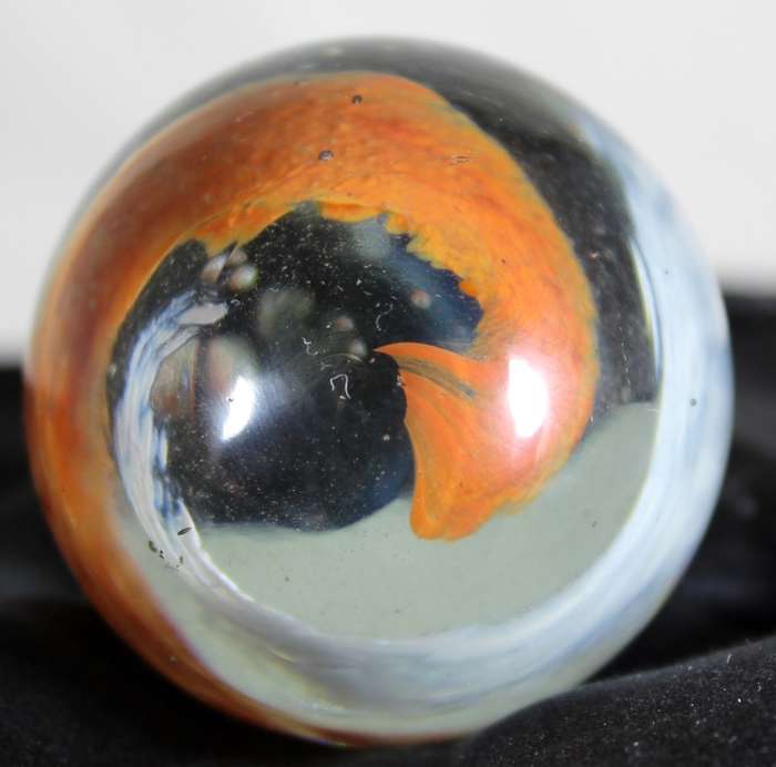 Small glass egg with swirl pattern