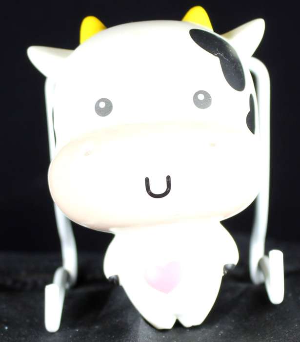 Baby cow with sucker