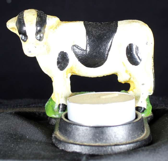Vintage cast iron cow candle holder