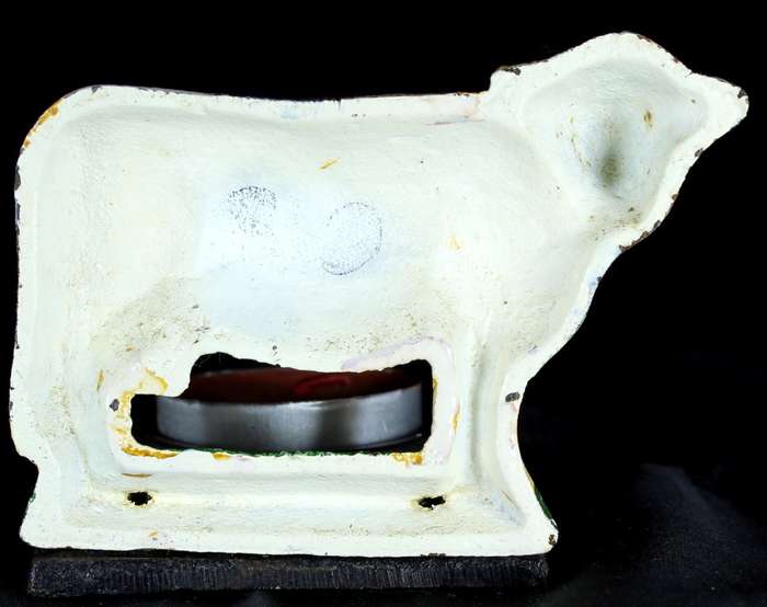 Vintage cast iron cow candle holder