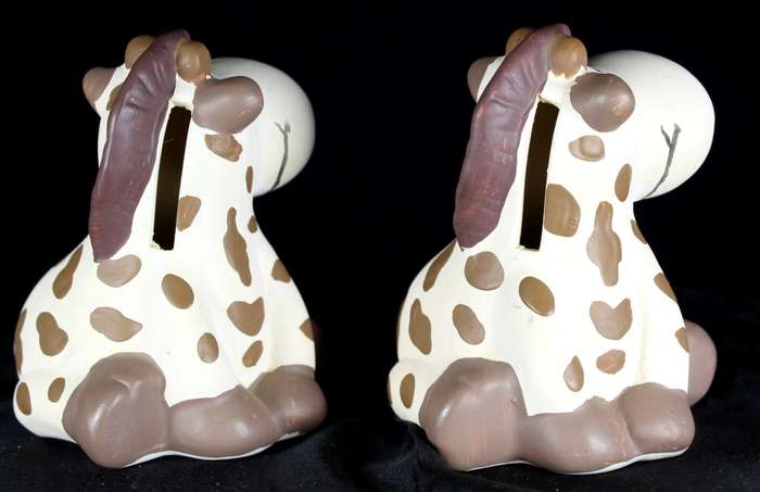 Pair of small ceramic cow money boxes