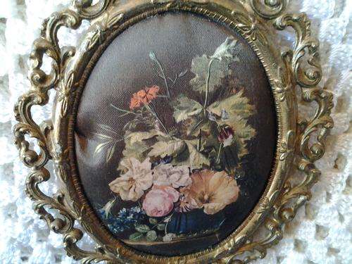 A vintage Brass Filigree frame with a satin padded victorian flower in vase setting. So ornate.