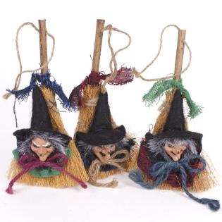 Witch head on broomstick