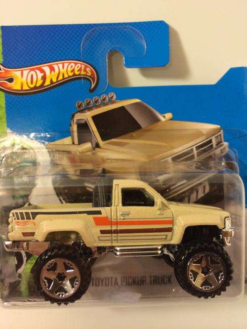 Hot Wheels 87 Toyota Pickup Truck  2013 Hot Wheels HW Showroom Hot Trucks (mint on card )