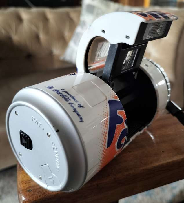 Vintage plastic camera in shape of Fanta Orange can