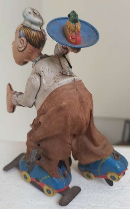 Vintage tin toy - humorous waiter on wheels
