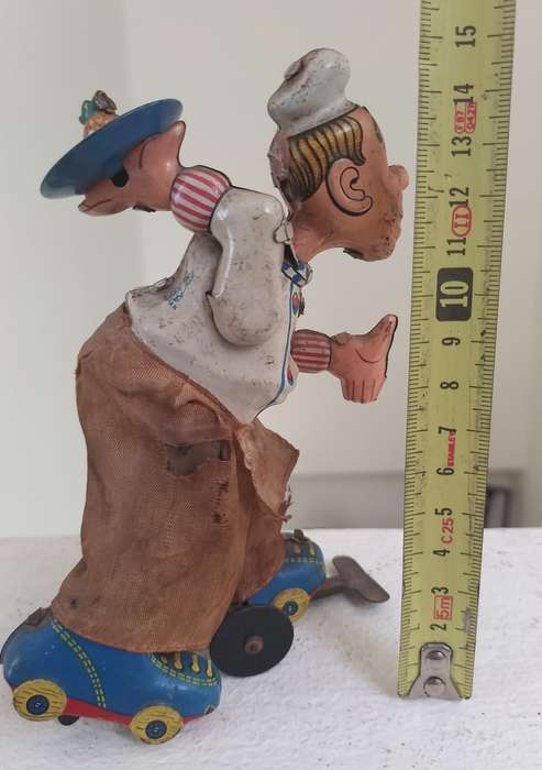 Vintage tin toy - humorous waiter on wheels