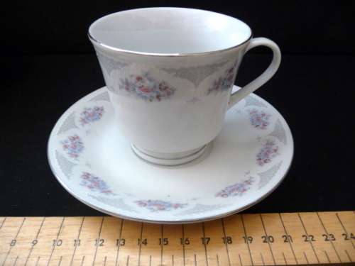 Four Cups and Saucers. Dainty Flowers and Lace Pattern. No Chips, no cracks. Made in China.