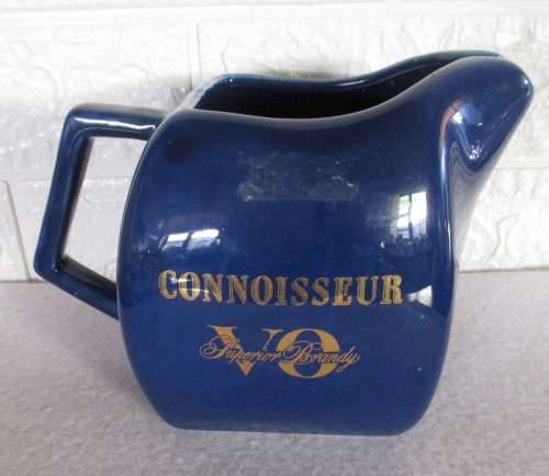 Vintage Dark Blue `Connoisseur V.O Superior Brandy` ceramic water jug with an ice lip. 130mm high.