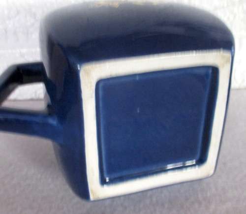 Vintage Dark Blue `Connoisseur V.O Superior Brandy` ceramic water jug with an ice lip. 130mm high.