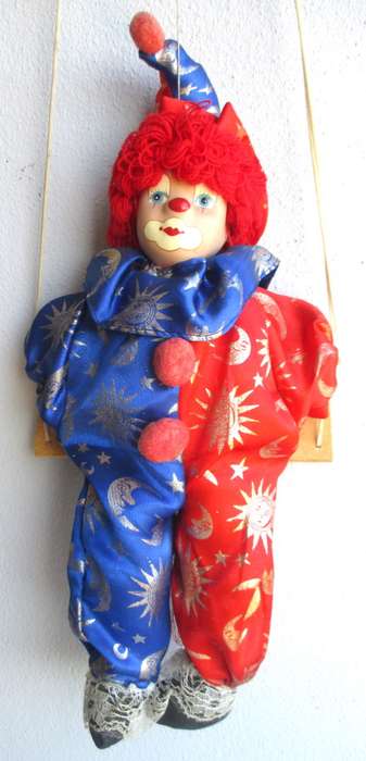Vintage Hanging Porcelain Face Clown Doll with Red Hair, on a swing. Doll 400mm long