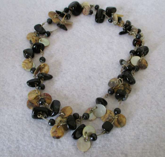 Lovely Mother of Pearl discs with black semi precious stone necklace. 90cm.