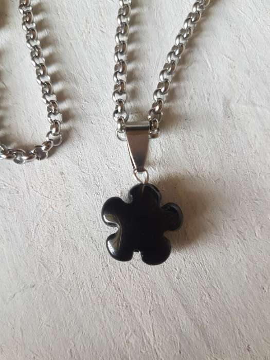 Stainless steel necklace with natural black onyx flower pendant