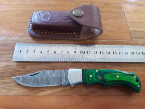 Handmade Damascus steel folding knife with WOODEN handle scales.
