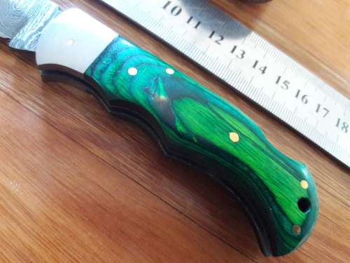 Handmade Damascus steel folding knife with WOODEN handle scales.