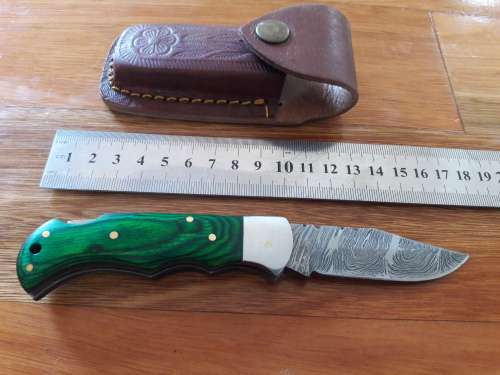Handmade Damascus steel folding knife with WOODEN handle scales.