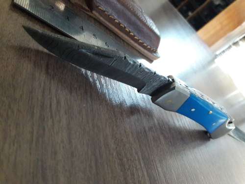Handmade Damascus steel folding knife with Resin handle scales.