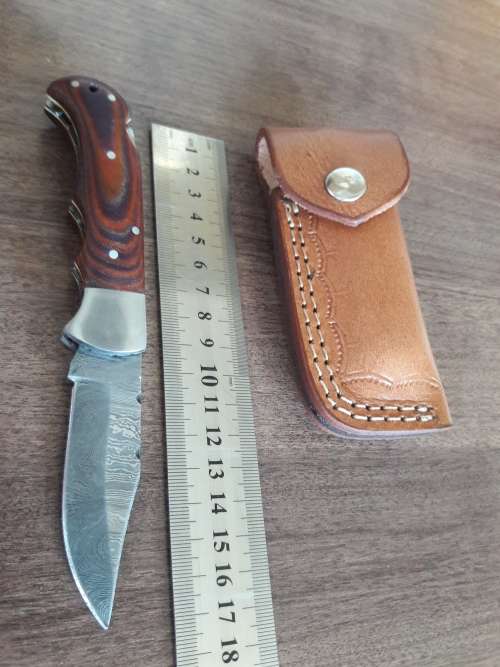 Handmade Damascus steel folding knife with MICARTA handle scales. THIS AUCTION will only ship 28th