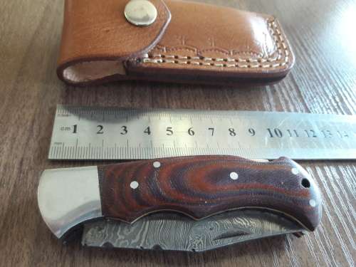 Handmade Damascus steel folding knife with MICARTA handle scales. THIS AUCTION will only ship 28th