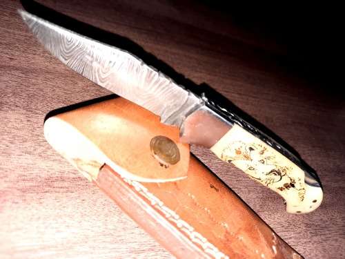 Handmade Damascus steel folding knife w Camel Bone Handle Scales. Art engraved.