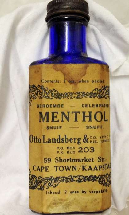 SNUFF`OTTO LANDSBERG & CO (PTY) LTD` MENTHOL SNUFF bottle-SMALL AMOUNT STILL IN cobolt blue BOTTLE