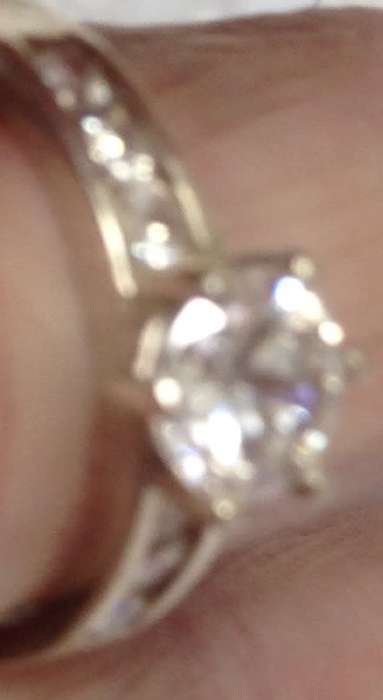 stamped 925 NV 9  --Sterling Nevada Silver mine size 9l  clear stone big middle each side 3 small