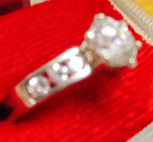 stamped 925 NV 9  --Sterling Nevada Silver mine size 9l  clear stone big middle each side 3 small
