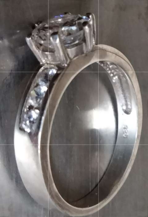 stamped 925 NV 9  --Sterling Nevada Silver mine size 9l  clear stone big middle each side 3 small